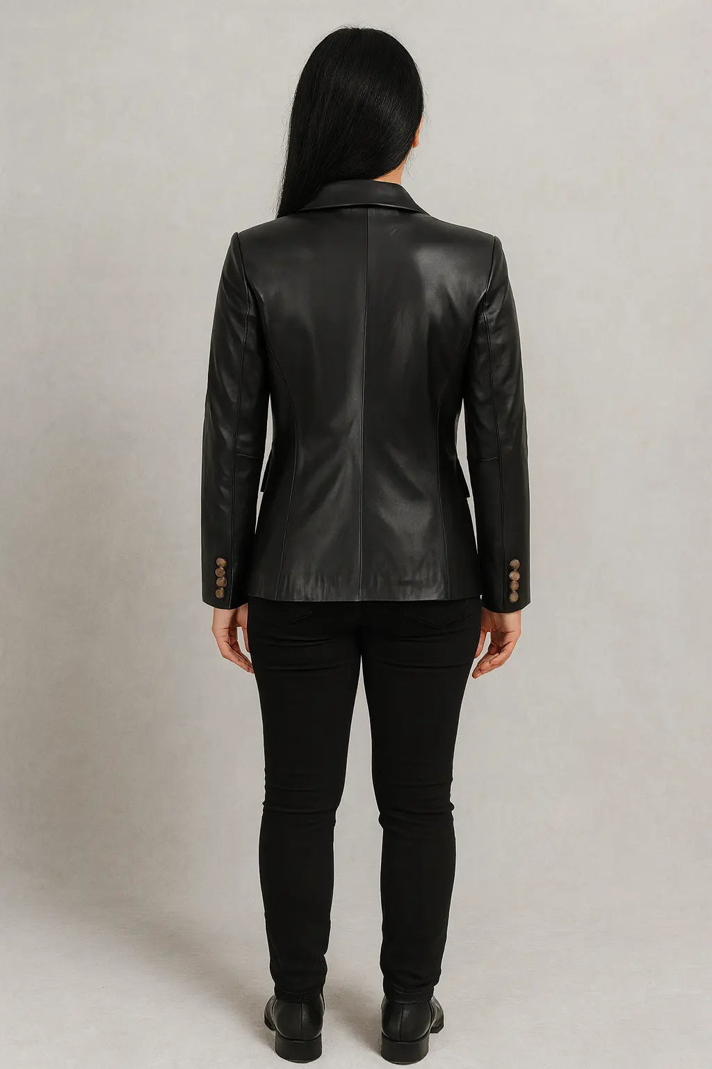 Back view of women’s slim fit black leather blazer with tailored cut